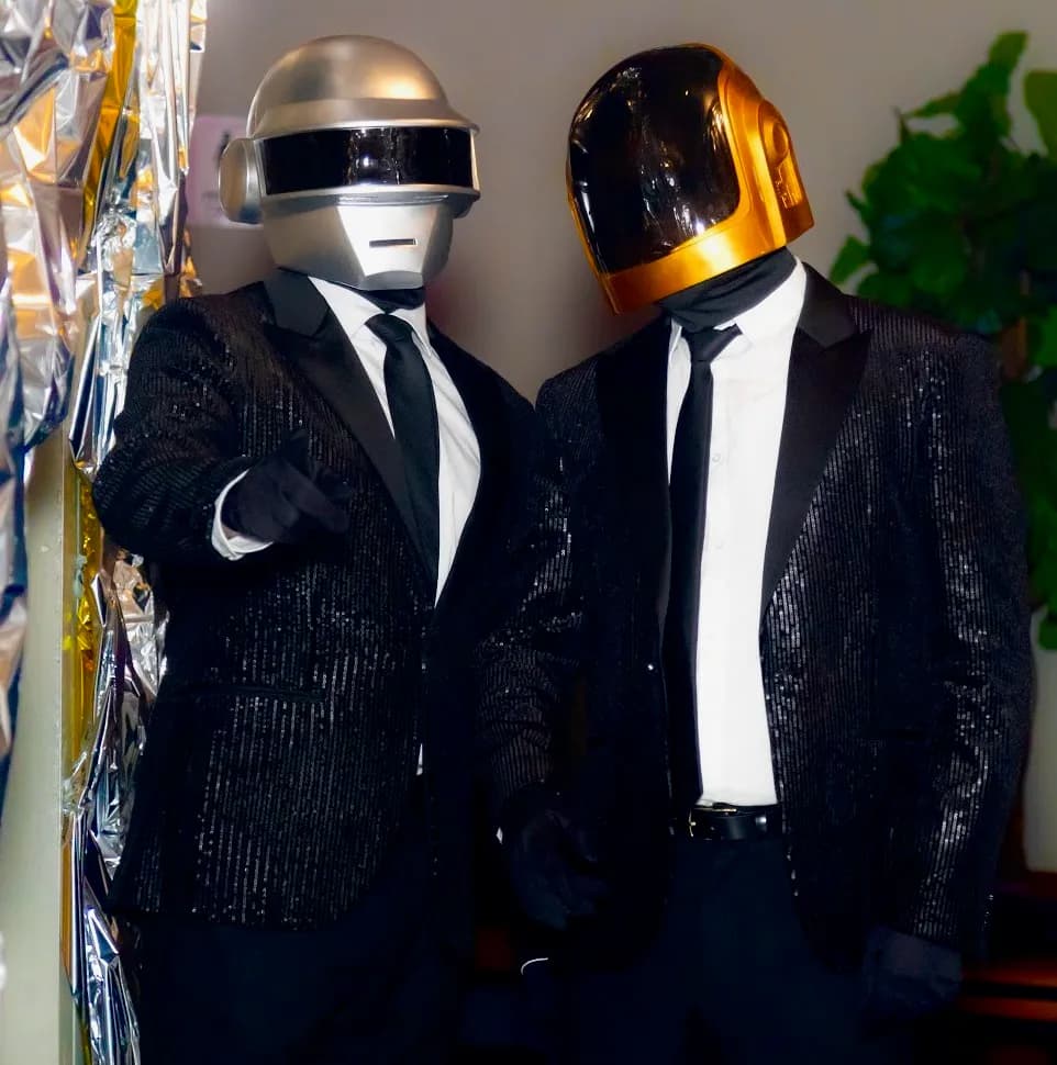 Christopher at a party with Daft Punk helmets